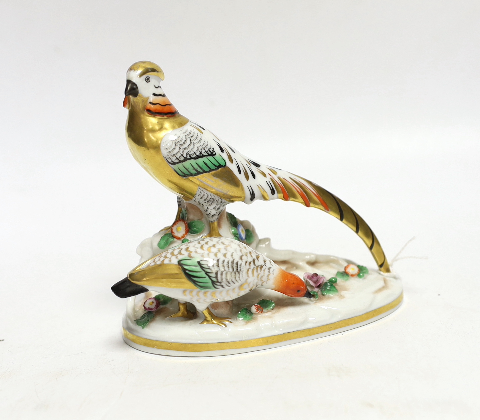 A continental porcelain pheasant group with gilt bodies, 12cm